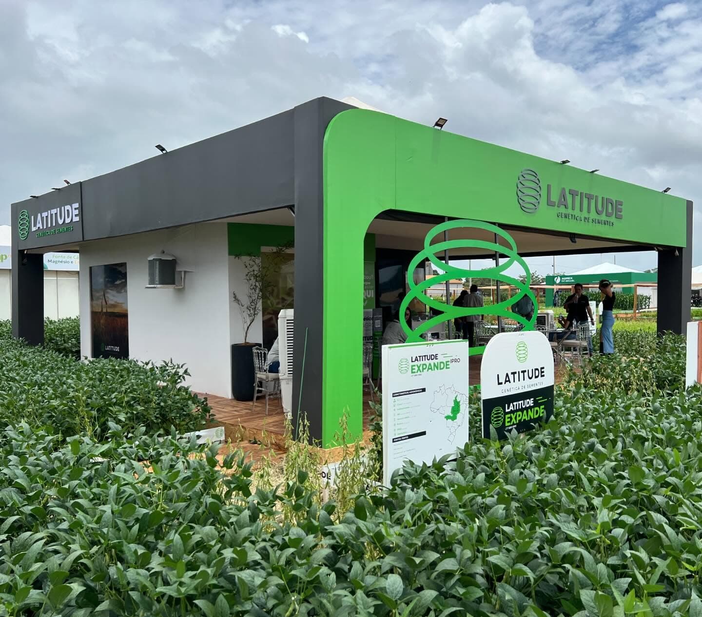 Latitude booth at a trade show, among the soybeans